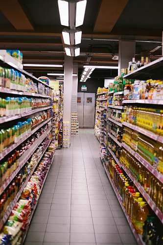 grocery store white and green labeled bottle on shelf shop